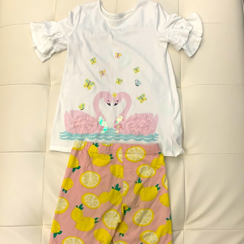 Long lemon shorts and a swan top